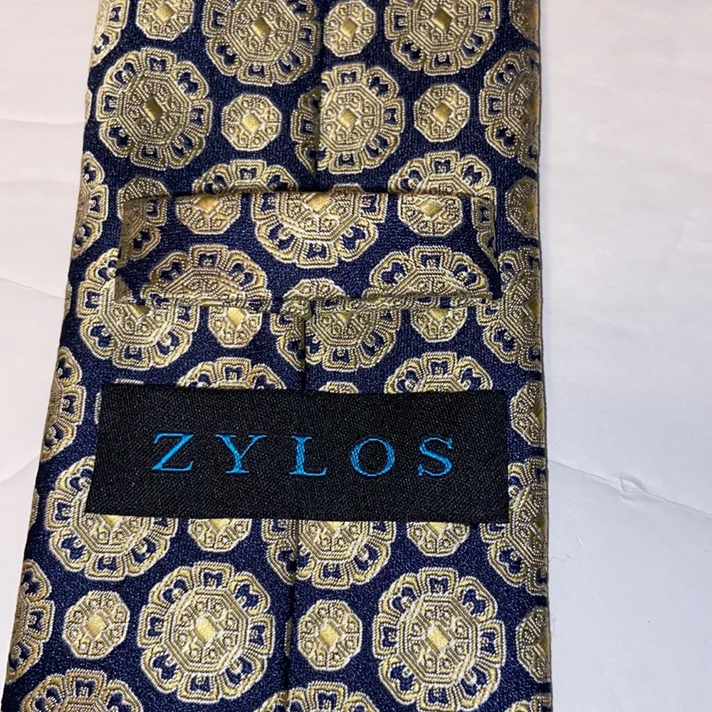Zylos neck tie navy blue with gold medallion design.